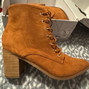 Brown suede boots with a 2 inch heel never worn